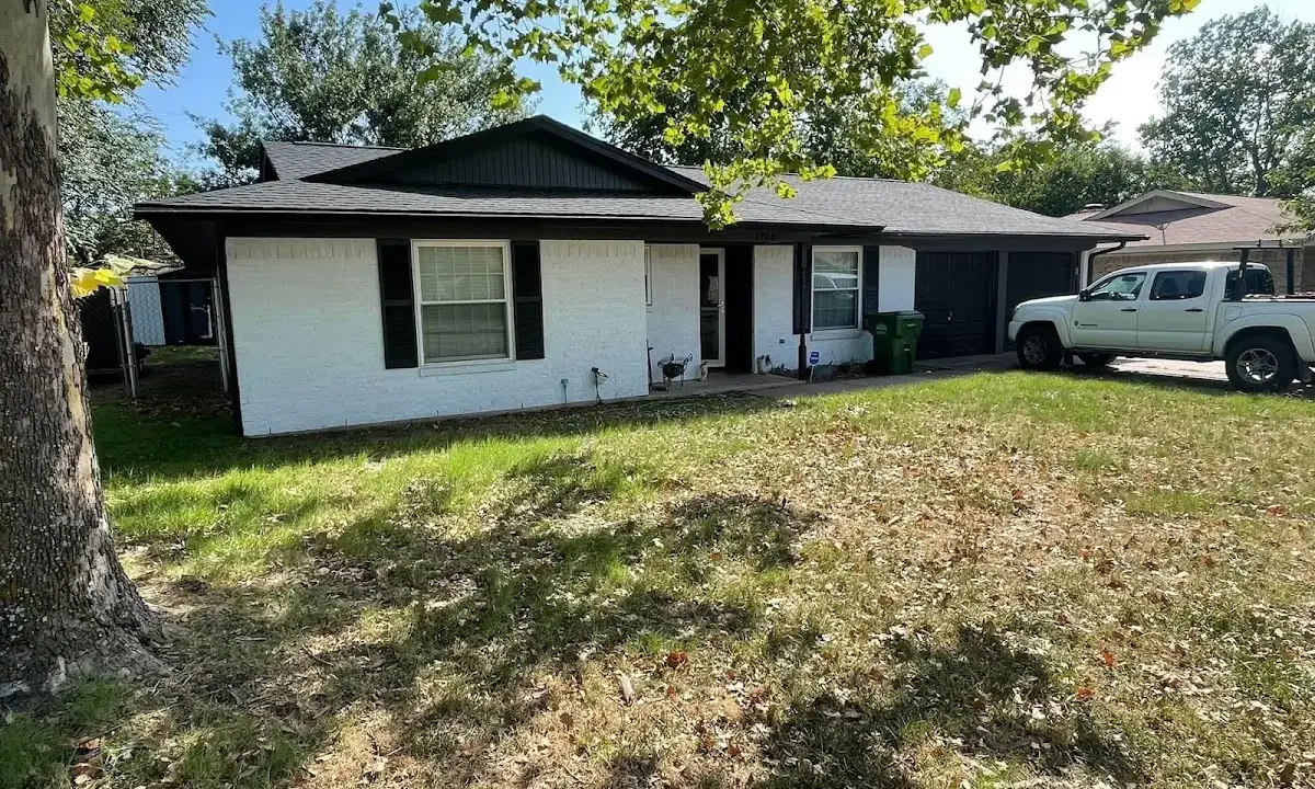 Professional roofing crew working on a residential roof in Tyrone